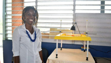 Photo of Brooklyn-based alumni group donates lab equipment to alma mater in SVG