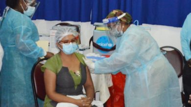 Photo of Dozens of frontline workers get COVID vaccines