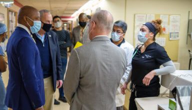 Photo of Adams, Schumer thank VA patients for their service