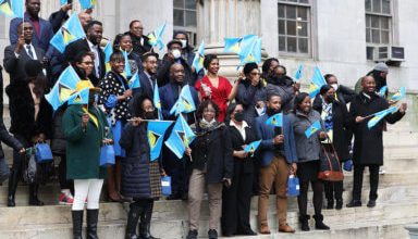 Photo of St. Lucians participate in flag-raising ceremony