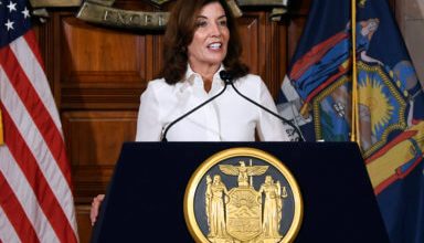 Photo of Hochul signs landmark John R. Lewis Voting Right Act of New York into law at MEC