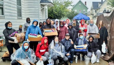 Photo of ‘Red Storm’ Track & Field team volunteers at Calvary’s mission food pantry
