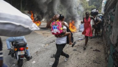 Photo of Former rebel leader arrives in Haiti’s capital as protests against prime minister gain momentum