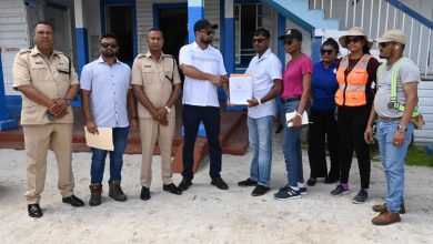 Photo of Contract for rebuilding of Anna Regina Police Station handed over