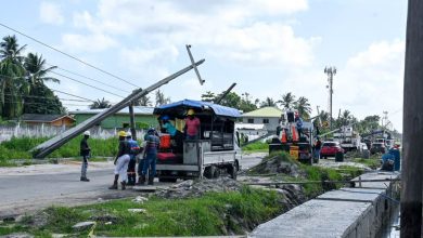 Photo of Utility poles collapse on Aubrey Barker Rd