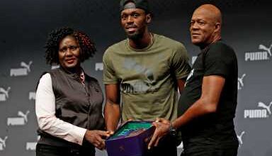 Photo of Bolt buries his dad. Government dubs him a national asset