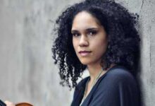 Photo of Award-winning female violinist mentoring students through new musical residency